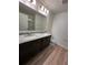 Full bath with double vanity and shower at 9436 Westside Hills Dr, Davenport, FL 33896