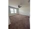 Spacious bedroom with neutral carpet and a ceiling fan at 9436 Westside Hills Dr, Davenport, FL 33896