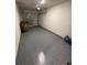 Two-car garage with epoxy floors and an automatic garage door opener at 9436 Westside Hills Dr, Davenport, FL 33896