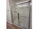 Modern bathroom shower features glass doors and a tiled interior at 9436 Westside Hills Dr, Davenport, FL 33896