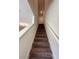 Carpeted staircase leading to the second floor of the home at 9436 Westside Hills Dr, Davenport, FL 33896