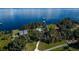 Beautiful aerial view of luxury waterfront properties surrounded by lush greenery and serene blue water at 9575 Ne 306Th Ct, Fort Mc Coy, FL 32134