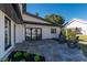 Spacious flagstone back patio with sliding glass doors and comfortable outdoor seating at 9575 Ne 306Th Ct, Fort Mc Coy, FL 32134