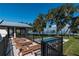 Beautiful backyard with a pool, lounge chairs, and a scenic lake view at 9575 Ne 306Th Ct, Fort Mc Coy, FL 32134