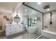 Modern bathroom with walk-in shower, soaking tub, and dual vanity at 9575 Ne 306Th Ct, Fort Mc Coy, FL 32134