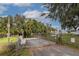 Gated boat ramp offering convenient access to serene waters, surrounded by lush greenery and mature trees at 9575 Ne 306Th Ct, Fort Mc Coy, FL 32134