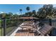 Relax on the deck with lounge chairs and enjoy the outdoor view and landscaping at 9575 Ne 306Th Ct, Fort Mc Coy, FL 32134