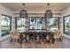 Beautiful dining area with views of the pool and backyard at 9575 Ne 306Th Ct, Fort Mc Coy, FL 32134