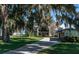 Inviting two-story home with well-manicured lawn, mature trees, and a private driveway at 9575 Ne 306Th Ct, Fort Mc Coy, FL 32134