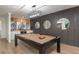 Game room featuring pool table, wood paneled wall, and wet bar at 9575 Ne 306Th Ct, Fort Mc Coy, FL 32134
