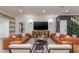 Cozy living room featuring modern furnishings, stylish decor, and a large entertainment center at 9575 Ne 306Th Ct, Fort Mc Coy, FL 32134