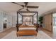 Comfortable bedroom with king bed, wooden floors and a ceiling fan at 9575 Ne 306Th Ct, Fort Mc Coy, FL 32134