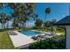 Scenic backyard oasis with a pool, spa, and lush landscaping offering tranquil views at 9575 Ne 306Th Ct, Fort Mc Coy, FL 32134