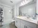 Bathroom featuring a bathtub with a shower, vanity with a white countertop, and modern fixtures at 993 Calico Pointe Cir, Groveland, FL 34736