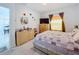 Comfortable bedroom featuring soft carpet, natural light, and a dresser for ample storage at 993 Calico Pointe Cir, Groveland, FL 34736