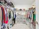 Spacious walk-in closet with ample storage space, shelving, and hanging rods at 993 Calico Pointe Cir, Groveland, FL 34736