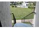 A view of the backyard and community pool from the unit's stairway at 1006 Plantation Dr # F11, Kissimmee, FL 34741