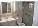 Cozy bathroom with a vanity, toilet, and stand up shower at 1006 Plantation Dr # F11, Kissimmee, FL 34741