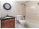 This bathroom has tile and a tub, shower, toilet, and vanity at 1100 Delaney Ave # F204, Orlando, FL 32806