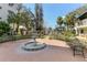 Courtyard with park benches and a fountain at 1100 Delaney Ave # F204, Orlando, FL 32806