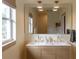 Modern bathroom with a double vanity and natural light at 12 S Lawsona Blvd, Orlando, FL 32801