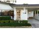 Inviting front door, a stylish carport, and manicured shrubbery create great curb appeal at 12 S Lawsona Blvd, Orlando, FL 32801