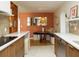 Kitchen with white countertops and dining nook with built-in seating and modern decor at 12 S Lawsona Blvd, Orlando, FL 32801