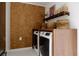 Laundry room featuring side by side washer and dryer with cork accent wall at 12 S Lawsona Blvd, Orlando, FL 32801