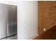 Bright laundry room with stainless steel refrigerator and built in storage space at 12 S Lawsona Blvd, Orlando, FL 32801