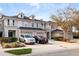 Beautiful two-story townhomes showcasing individual garages and private balconies under a serene sky at 1218 Falling Star Ln, Orlando, FL 32828