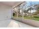 Screened patio surrounded by lush landscaping and trees, offering privacy at 1218 Falling Star Ln, Orlando, FL 32828