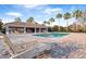 Community pool area with lounge chairs, covered seating, and mature palm trees at 1218 Falling Star Ln, Orlando, FL 32828