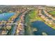 Beautiful aerial view of the neighborhood with ponds, a golf course, and lush landscaping at 13231 Woodford St, Orlando, FL 32832