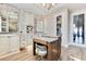 Stylish bathroom featuring dual vanities, a central island, and a luxurious soaking tub at 13231 Woodford St, Orlando, FL 32832