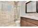 Modern bathroom featuring a glass-enclosed shower, stylish tile accents, and a vanity with ample counter space at 13231 Woodford St, Orlando, FL 32832