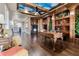 Bright office with rich wood trim, custom built-ins and unique sky-themed ceiling design at 13231 Woodford St, Orlando, FL 32832