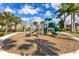 Community playground with modern play equipment, slide, and a soft landing surface at 13231 Woodford St, Orlando, FL 32832