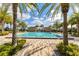 Community pool area lined with palm trees at 13231 Woodford St, Orlando, FL 32832