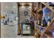 Beautiful wine cellar featuring stone accents, custom lighting, and ample storage for a large collection at 13231 Woodford St, Orlando, FL 32832