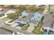 Aerial view of a blue townhome with multiple garages and landscaped lawn at 14216 Mailer Blvd, Orlando, FL 32828