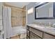 Bathroom features a shower and tub combo, granite countertops, and modern fixtures at 14216 Mailer Blvd, Orlando, FL 32828