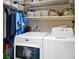 Laundry room area with side-by-side washer and dryer units at 14216 Mailer Blvd, Orlando, FL 32828