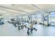 A modern gym with treadmills, weights, and exercise bikes offers residents a convenient workout space at 1431 Milledge Ln, Davenport, FL 33896