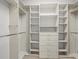 Spacious walk-in closet with custom shelving and drawers at 1431 Milledge Ln, Davenport, FL 33896