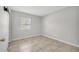 Bedroom with neutral paint, tile floors, and a window at 161 Laurel Way, Kissimmee, FL 34743