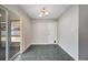 Bright dining area with gray tile flooring and classic light fixture at 161 Laurel Way, Kissimmee, FL 34743