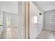 Bright hallway featuring neutral paint, tile floors and natural light from the window at 161 Laurel Way, Kissimmee, FL 34743