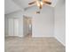 Spacious living room featuring vaulted ceilings, tile flooring, and neutral paint at 161 Laurel Way, Kissimmee, FL 34743