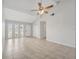 Bright living room with tile flooring, vaulted ceiling, and a ceiling fan at 161 Laurel Way, Kissimmee, FL 34743