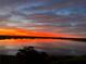 Beautiful water view with a colorful sunset reflecting on the water at 16300 County Road 455 # 607, Montverde, FL 34756